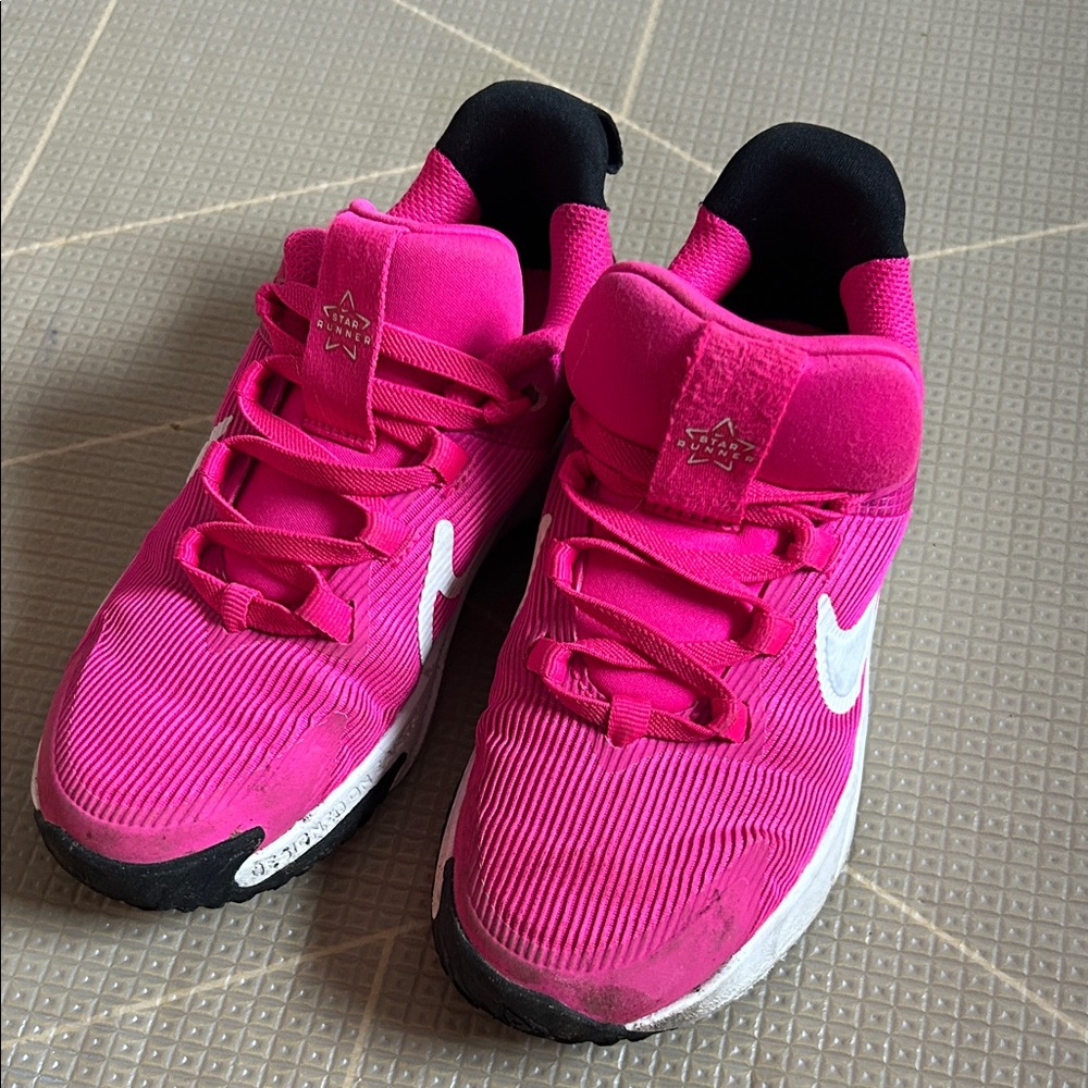Nike Hot Pink Running Shoes with White Swoosh and Black Heel